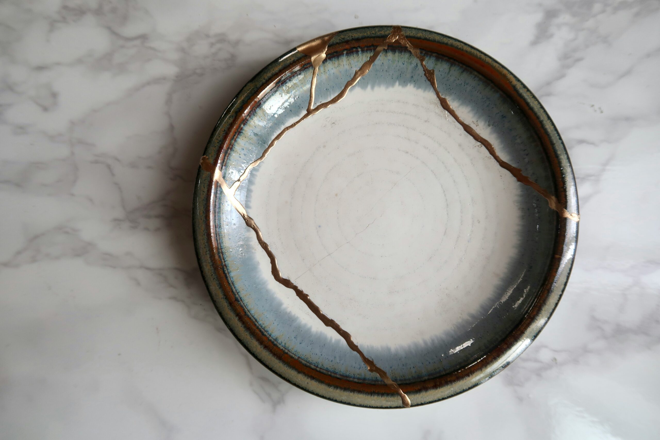 Kintsugi pottery symbolising how seeing limiting beliefs differently can change your perspective