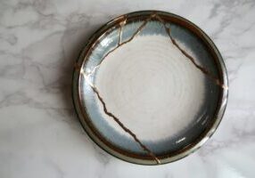 Kintsugi pottery symbolising how seeing limiting beliefs differently can change your perspective